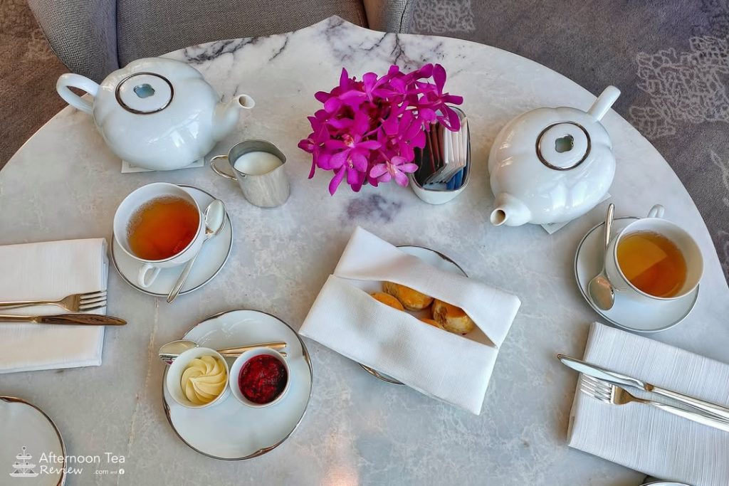 Scones, clotted cream, berry jam, 2 pots of tea